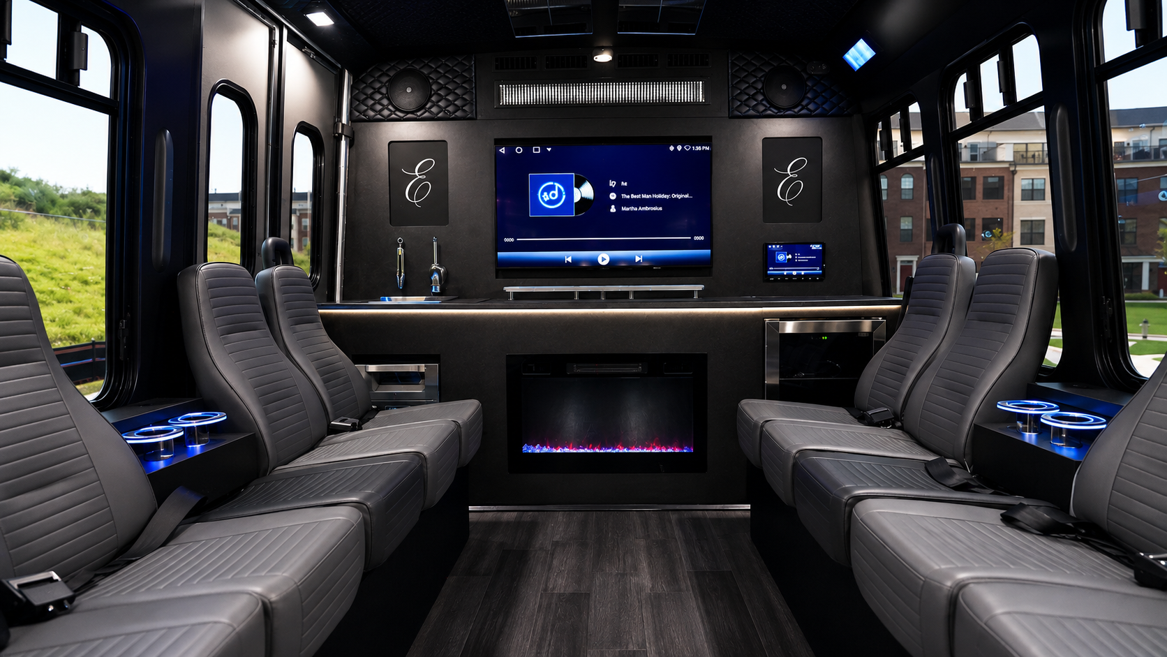 Luxury bus interior with leather seating, fireplace, bar and entertainment